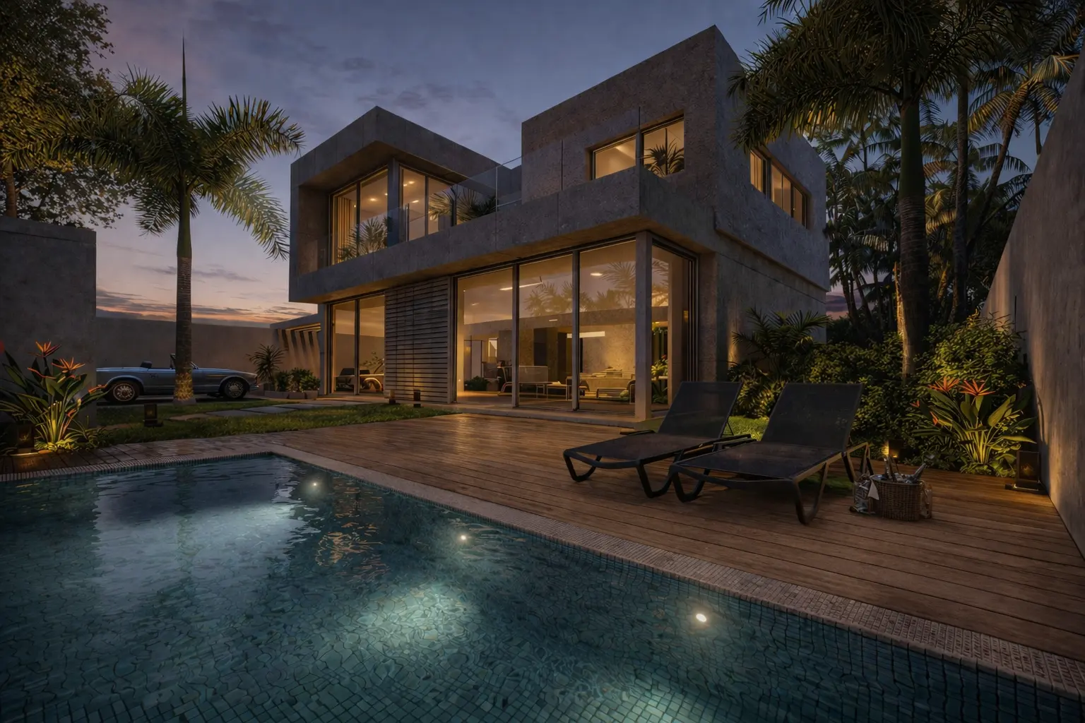 Vista al atardecer de Villa AA iluminada junto a la piscina